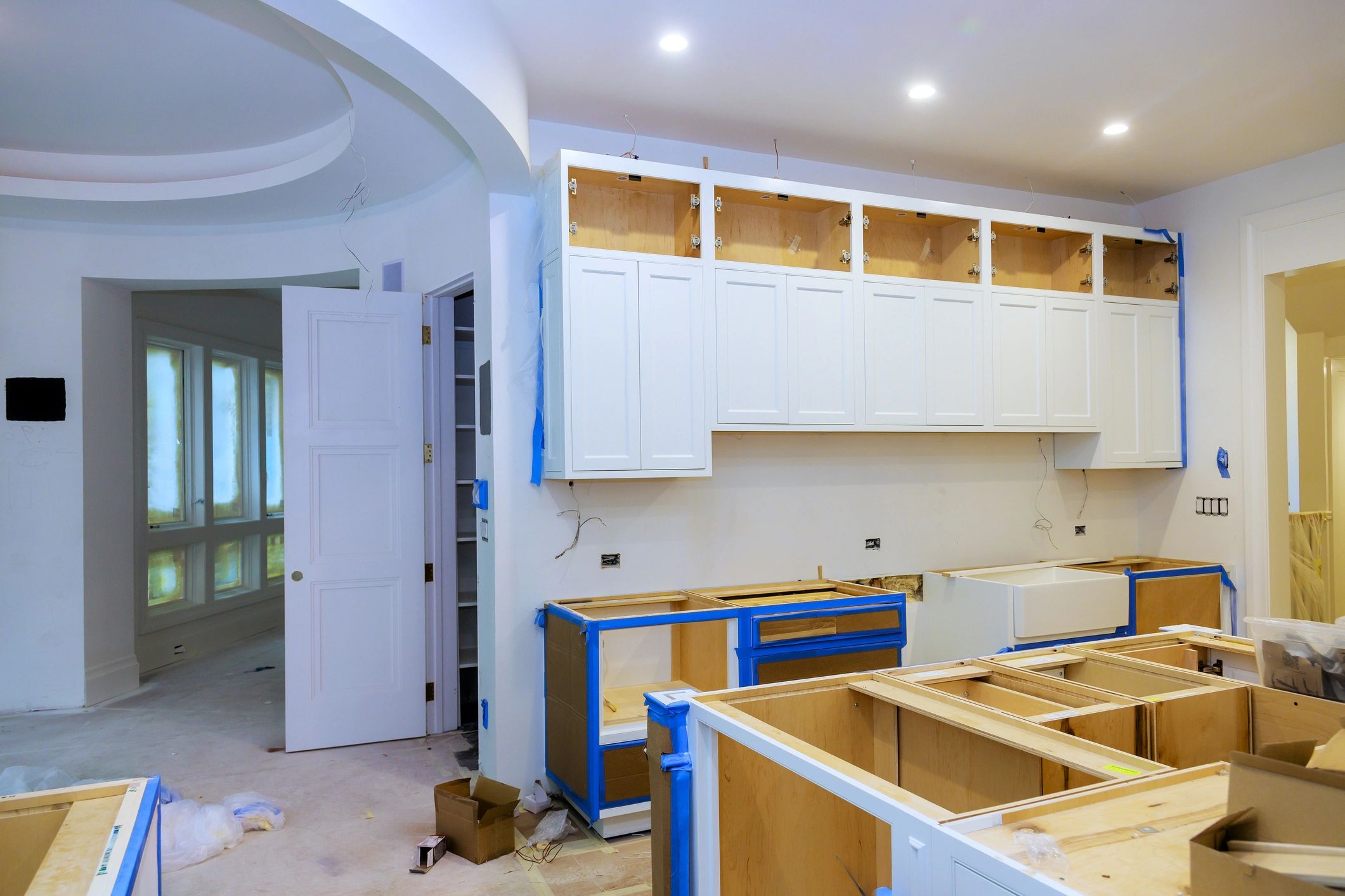 House Construction Framing Gradating Into Finished Kitchen Build.